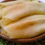 স্বাস্থ্য সচেতন বলে পিঠে খান না? স্বাদবদল করুন ভেটকির পাটিসাপটা বানিয়ে