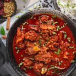 কষা মাংসের গণ্ডি ছাড়িয়ে: শীতের টেবিলে রাজকীয় পাঁঠার ভিন্ডালু